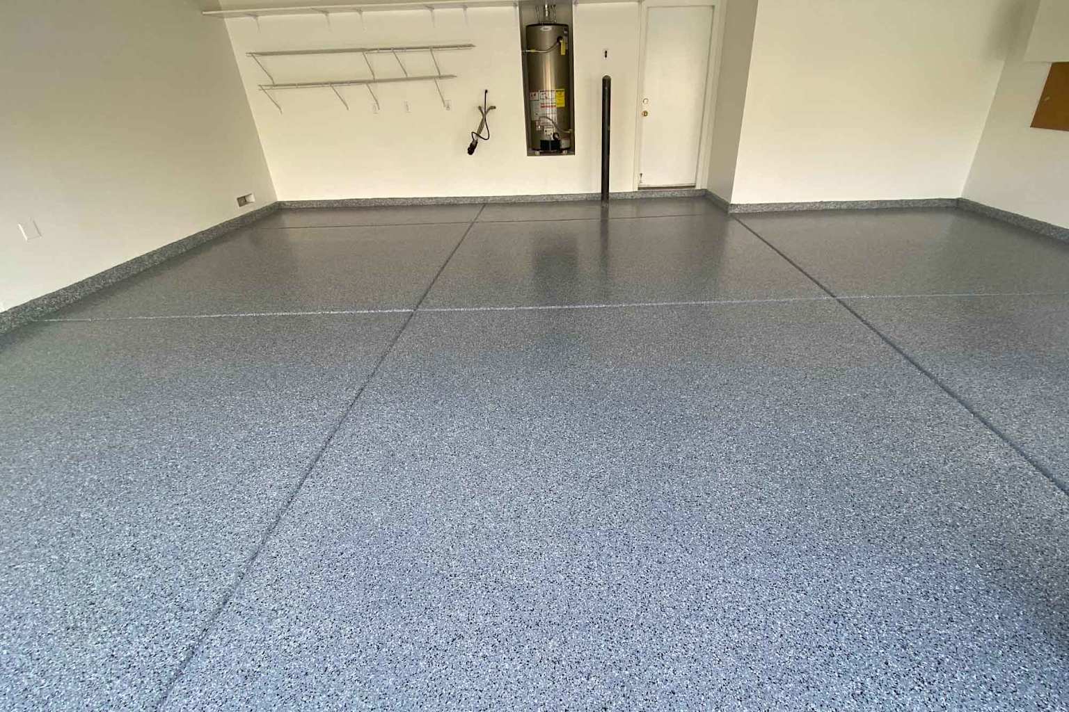 Decorative flake-coated garage floor in a clean residential garage